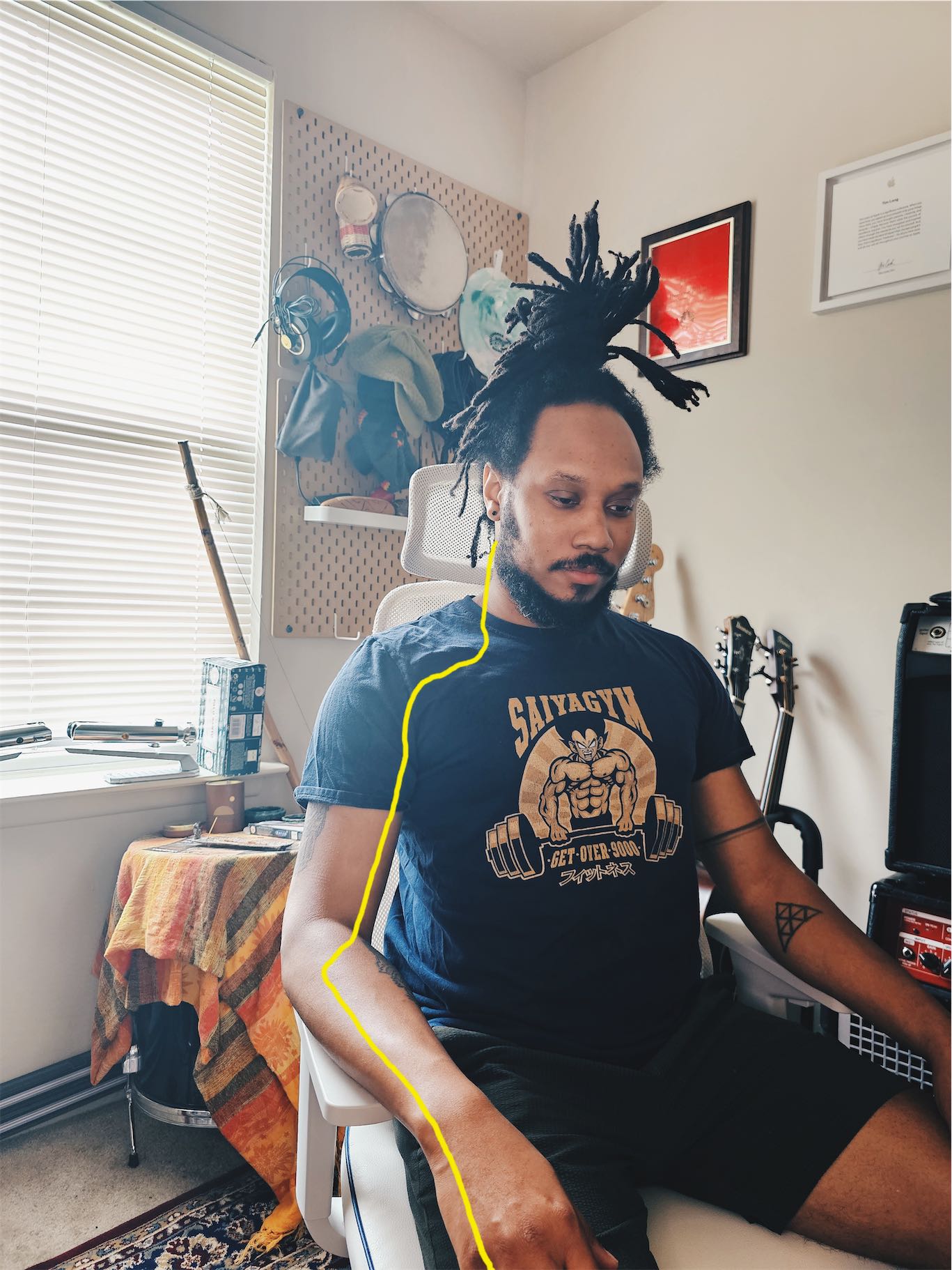 Annotated Photo of me. There is a yellow line drawn that is meant to loosely trace the path of the ulnar nerve from the back of the head into fingers.